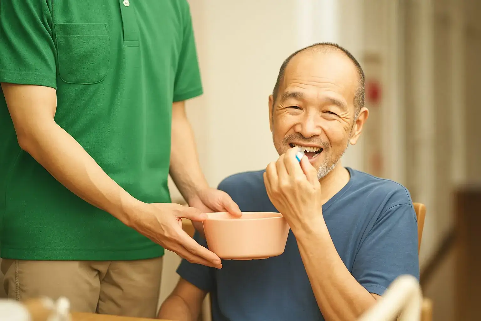 A man sitting at the table with his bowl in front of him.